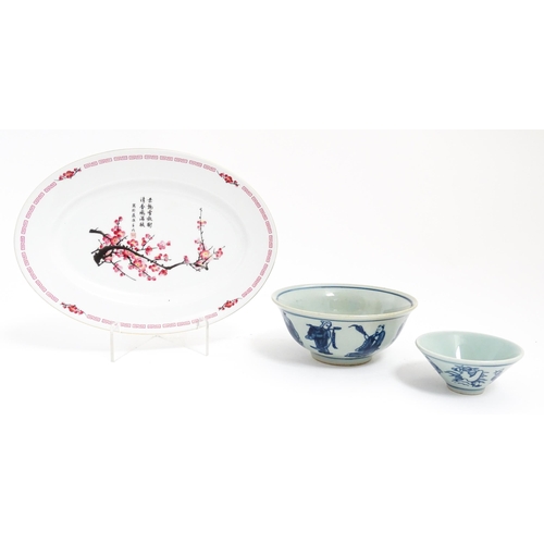 105 - Three Oriental items comprising a blue and white bowl decorated with the eight immortals, a sake bow... 