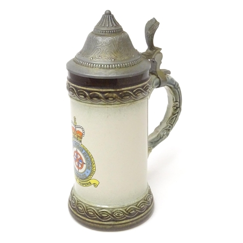 107 - Militaria : a mid 20thC stein tankard, decorated with the insignia of RAF Gütersloh (HQ No.2 Group R... 