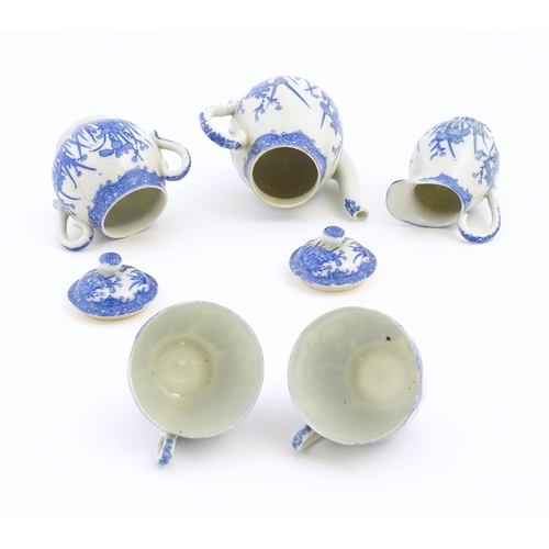 246 - A quantity of Oriental blue and white tea wares decorated with iris flowers and foliage, to include ... 