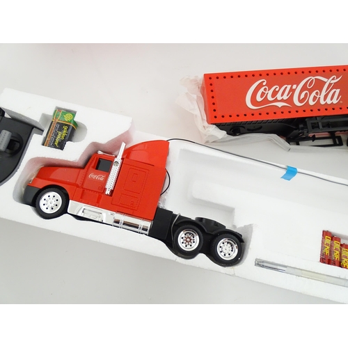 316 - Toy: A Dickie-Spielzeug advertising 2-channel radio controlled Coca Cola Christmas lorry. Boxed. Box... 