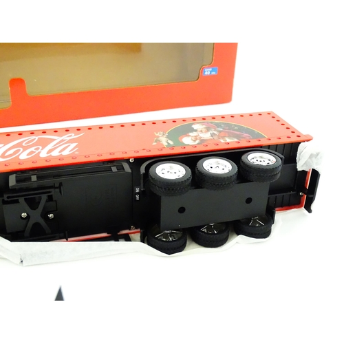 316 - Toy: A Dickie-Spielzeug advertising 2-channel radio controlled Coca Cola Christmas lorry. Boxed. Box... 