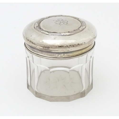 408 - A glass dressing table pot of circular form with Continental .800 silver lid. Approx. 3