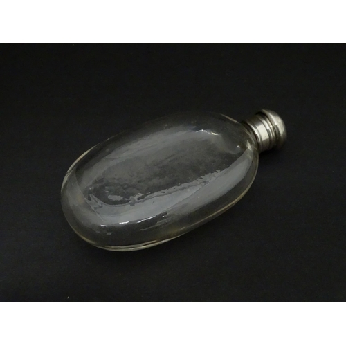 422 - A glass hip flask of ovoid form with screw top. Approx. 4 3/4