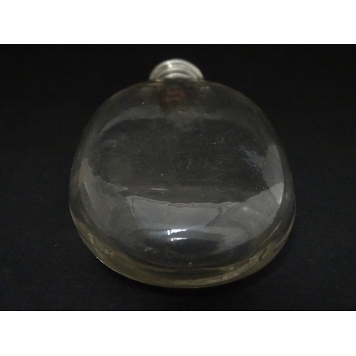 422 - A glass hip flask of ovoid form with screw top. Approx. 4 3/4