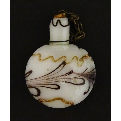 429 - A small art glass scent / perfume flask in the Venetian style. Approx. 1 1/2