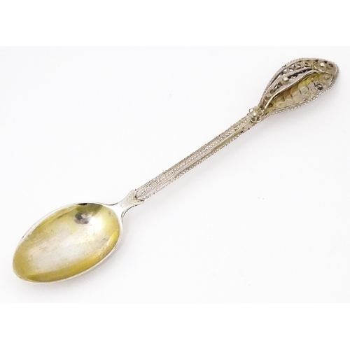 435 - A Continental .830 silver soon with filigree decoration to handle. Indistinctly marked. Possibly Sca... 