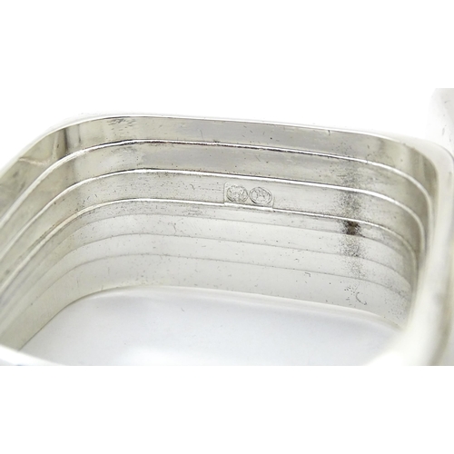 460 - A set of four 'capri' pattern silver plate napkin rings. Produced for Wedgwood.