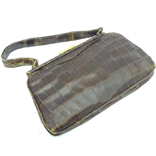 501 - A vintage crocodile handbag with purse and mirror