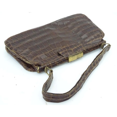 501 - A vintage crocodile handbag with purse and mirror