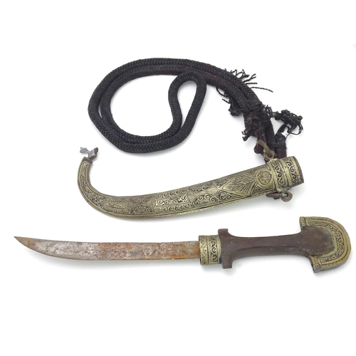 502 - A Middle Eastern / North African Jambiya dagger / knife and sheath with rope belt, approx 16