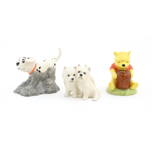 523 - Two Royal Doulton Disney figures comprising Pooh and the Honey Pot WP1, and 101 Dalmatians Rolly DM ... 