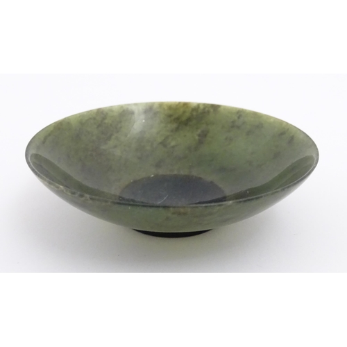 527 - An Oriental carved jade coloured hardstone dish. Approx. 3