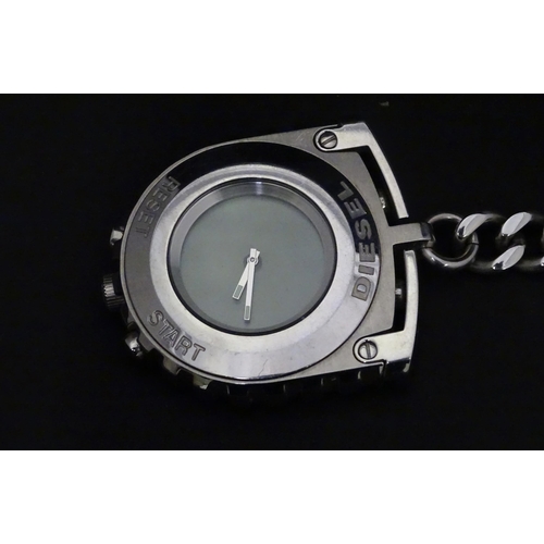 546 - A boxed Diesel watch / stopwatch on chain, approx 2