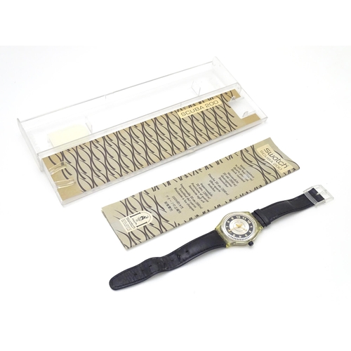 547 - A Swatch watch with case