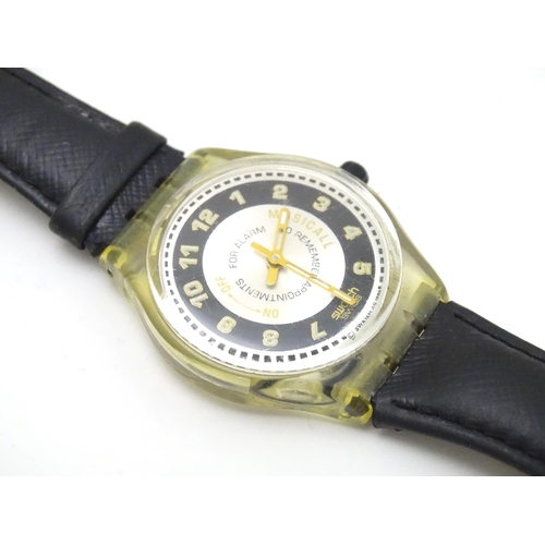 547 - A Swatch watch with case