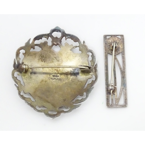 567 - A silver brooch inspired by the designs of Charles Rennie Macintosh, together with a brooch marked S... 