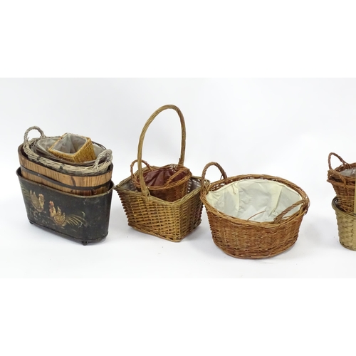 586 - A bamboo and rattan circular table together with a collection of wicker baskets, etc.