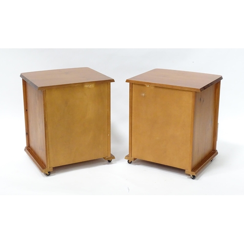 615 - A pair of pine bedside cabinets, each with three drawers with turned wooden handles. 18