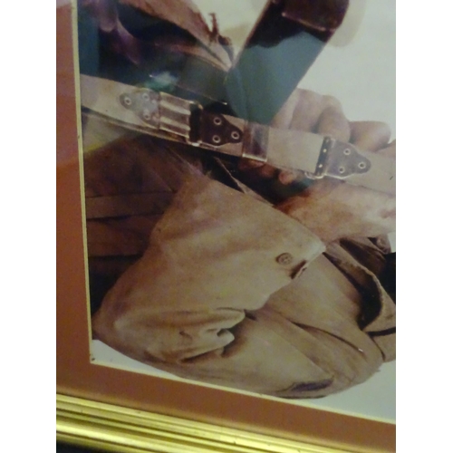 621 - A framed photograph of Tom Hanks from the movie Saving Private Ryan. Photograph approx. 9