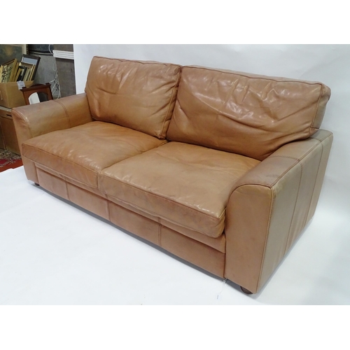 658 - A 20thc large two seat leather sofa, 78