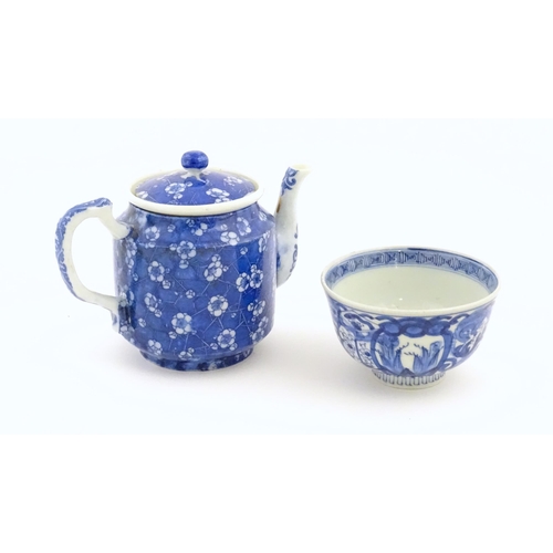 698 - A Chinese blue and white teapot decorated with prunus blossom. Together with a Chinese blue and whit... 