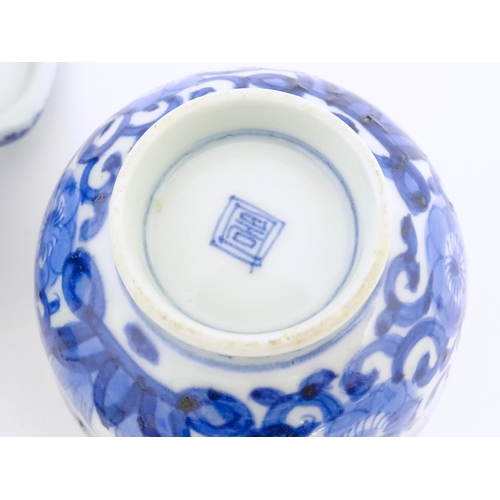 698 - A Chinese blue and white teapot decorated with prunus blossom. Together with a Chinese blue and whit... 