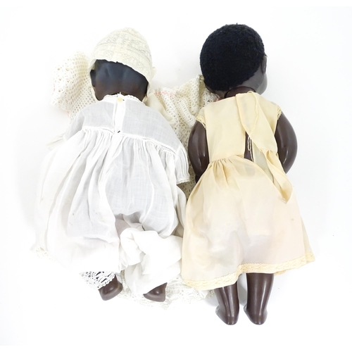 709 - Toys: Two 20thC plastic black dolls, to include an example by Pedigree with blinking eyes, painted l... 