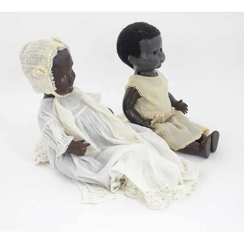 709 - Toys: Two 20thC plastic black dolls, to include an example by Pedigree with blinking eyes, painted l... 