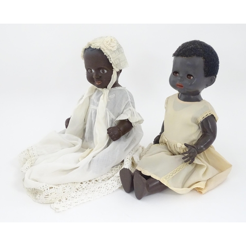 709 - Toys: Two 20thC plastic black dolls, to include an example by Pedigree with blinking eyes, painted l... 