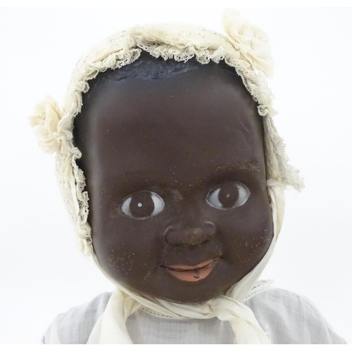 709 - Toys: Two 20thC plastic black dolls, to include an example by Pedigree with blinking eyes, painted l... 