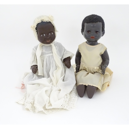 709 - Toys: Two 20thC plastic black dolls, to include an example by Pedigree with blinking eyes, painted l... 