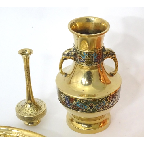 757 - A quantity of assorted brass and copper wares to include chargers, dishes, vase, etc.