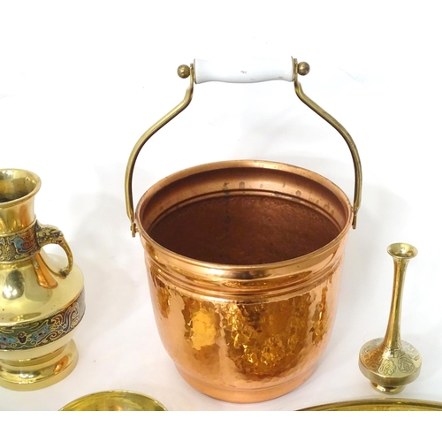 757 - A quantity of assorted brass and copper wares to include chargers, dishes, vase, etc.