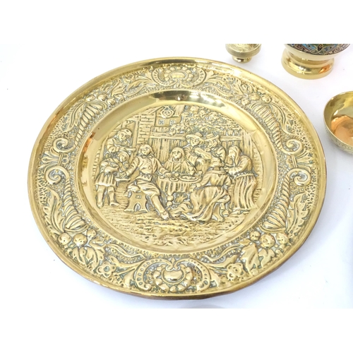 757 - A quantity of assorted brass and copper wares to include chargers, dishes, vase, etc.