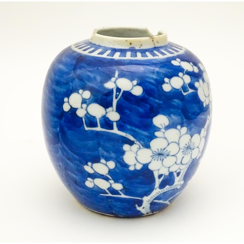 819 - Three Chinese items comprising a blue and white vase with prunus blossom, a bowl with dragon and sty... 