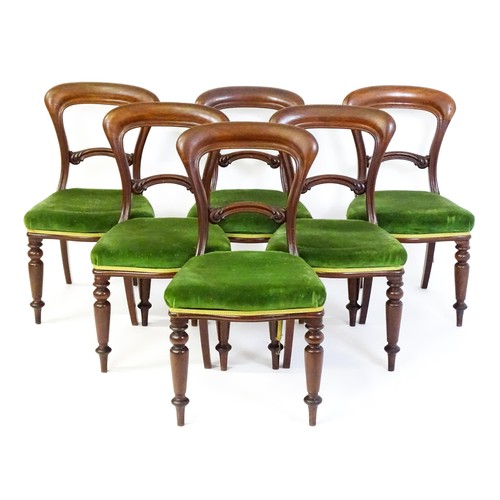 831 - A set of six Victorian balloon back dining chairs with carved mid rails and baluster turned front le... 