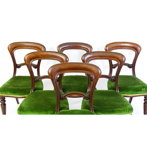 831 - A set of six Victorian balloon back dining chairs with carved mid rails and baluster turned front le... 