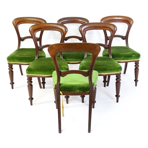 831 - A set of six Victorian balloon back dining chairs with carved mid rails and baluster turned front le... 