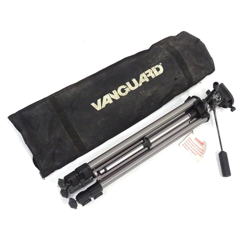 837 - A cased telescoping and extending Vanguard camera / photography tripod, approx 52