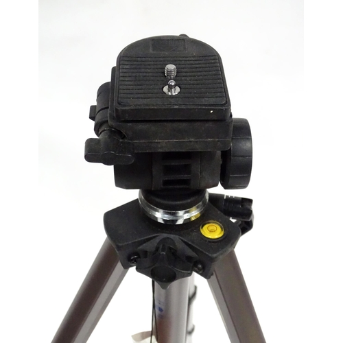 837 - A cased telescoping and extending Vanguard camera / photography tripod, approx 52