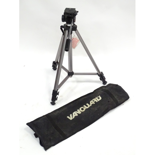 837 - A cased telescoping and extending Vanguard camera / photography tripod, approx 52