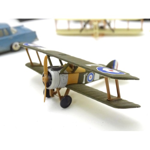 877 - Toys: A quantity of assorted scale model planes and vehicles, comprising four Corgi biplanes, Corgi ... 