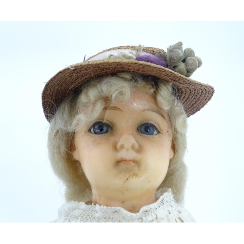 901 - Toy: A 20thC doll with wax head, glass eyes, painted features, composite arms and lower legs. Approx... 