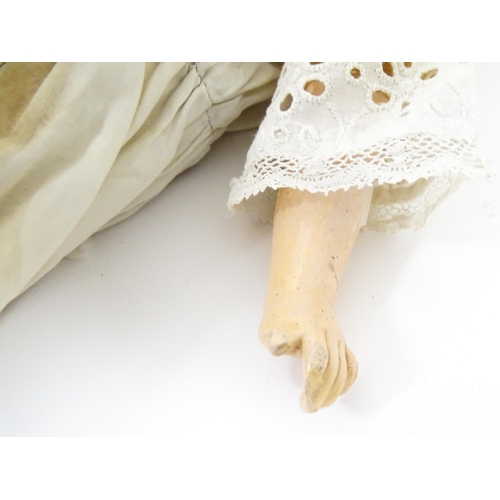 901 - Toy: A 20thC doll with wax head, glass eyes, painted features, composite arms and lower legs. Approx... 