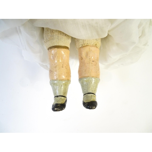 901 - Toy: A 20thC doll with wax head, glass eyes, painted features, composite arms and lower legs. Approx... 