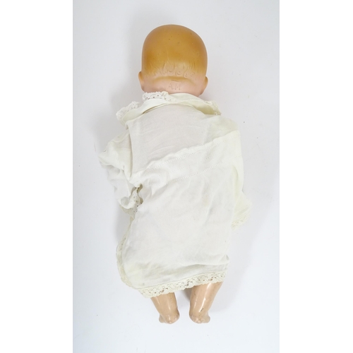 902 - Toy: An Armand Marseille doll with bisque head, blinking eyes, two front teeth, painted features and... 