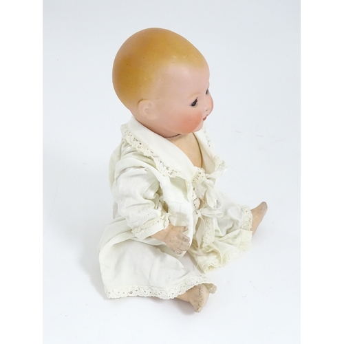 902 - Toy: An Armand Marseille doll with bisque head, blinking eyes, two front teeth, painted features and... 