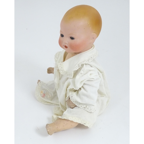 902 - Toy: An Armand Marseille doll with bisque head, blinking eyes, two front teeth, painted features and... 