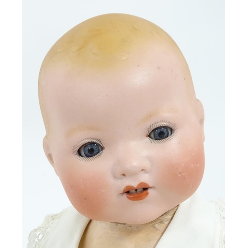 902 - Toy: An Armand Marseille doll with bisque head, blinking eyes, two front teeth, painted features and... 