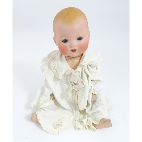 902 - Toy: An Armand Marseille doll with bisque head, blinking eyes, two front teeth, painted features and... 